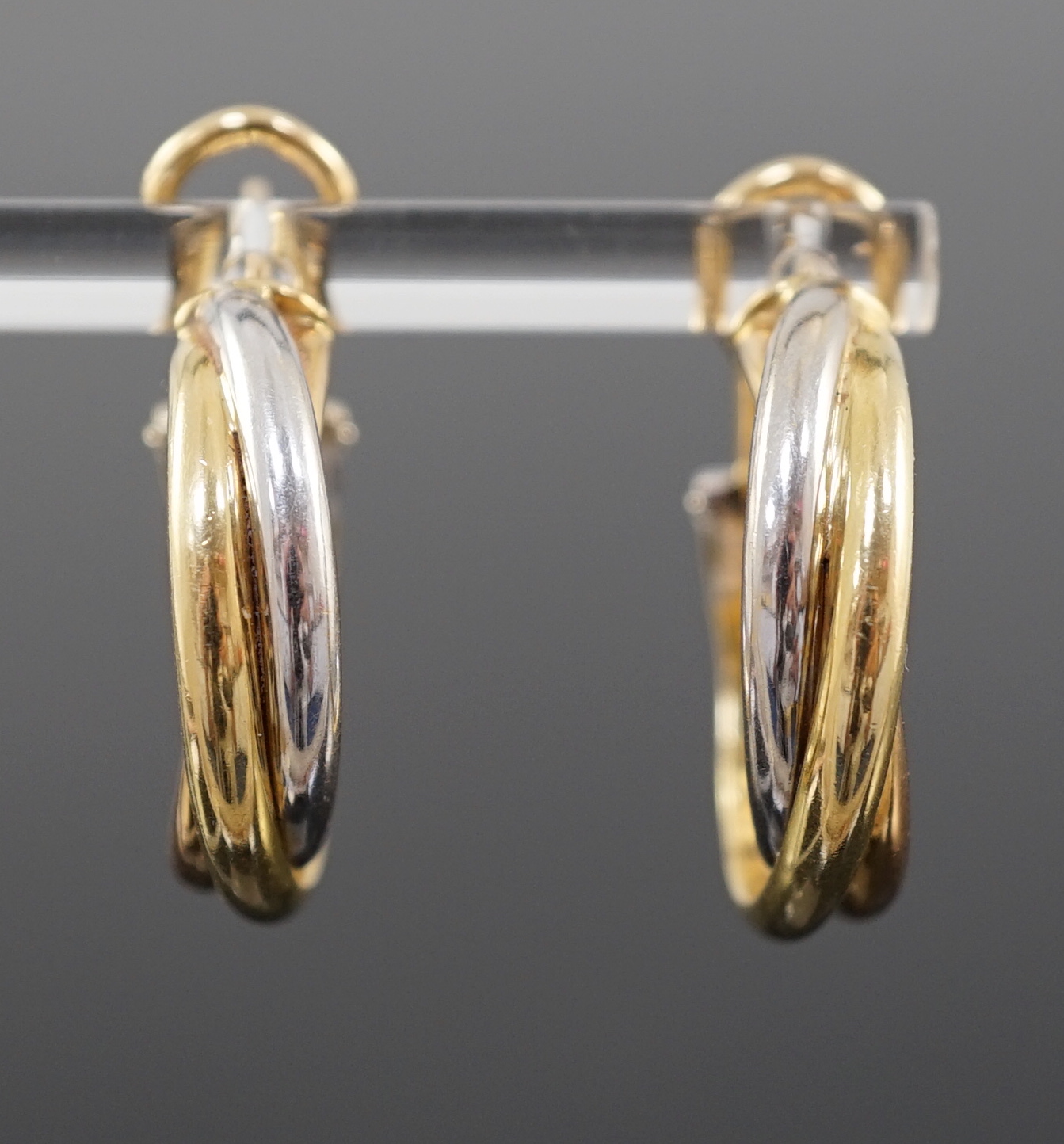 A modern pair of Cartier three colour 18ct gold Trinity earrings